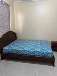 Bedroom with window overlooking courtyard natural light tile floors Costa Verde Colón