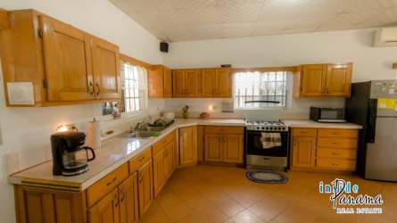 Bright tiled living room with ceiling fans in Pocri Los Santos country house for sale