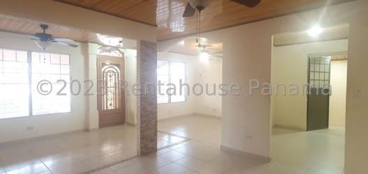 Living room with wood ceiling, fan, window bars Montelimar La Chorrera Panama