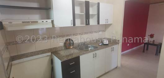 Bathroom with frosted glass shower, tiles, mirror, sink in La Chorrera