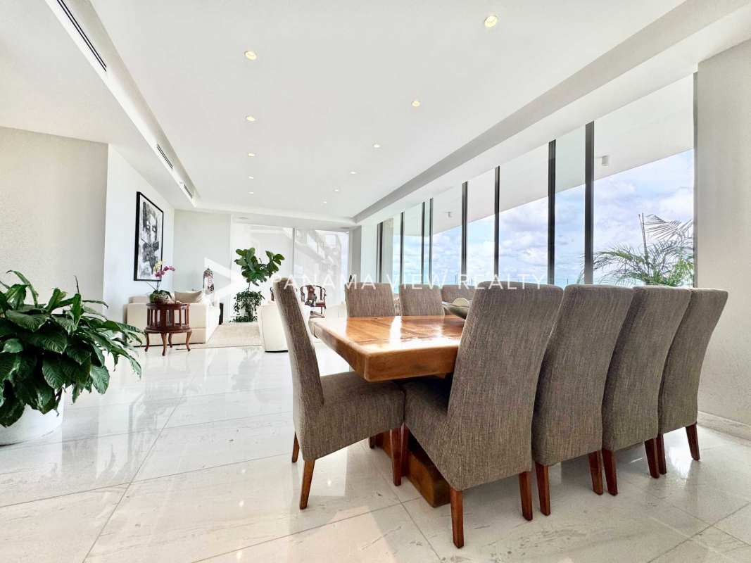Elegant dining area with marble flooring and large windows La Maison by Fendi Santa Maria Panama