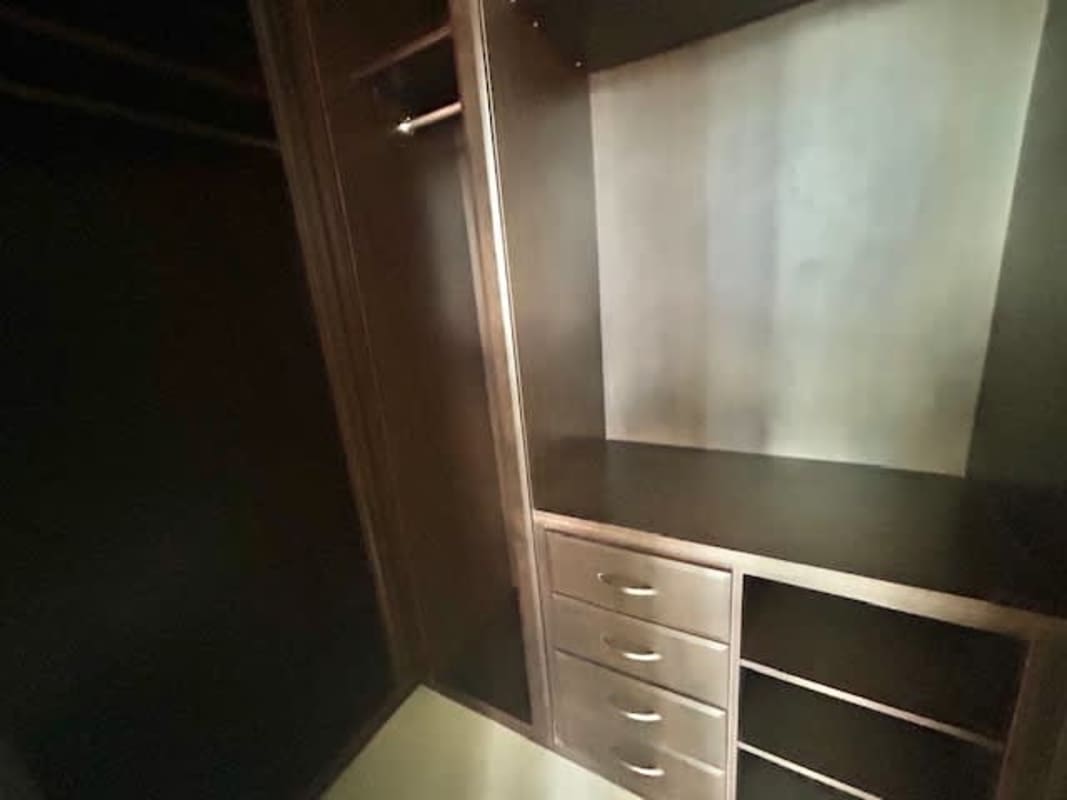 Large living area with tile floors and panoramic window views at PH The Bridge Ancón Panama City