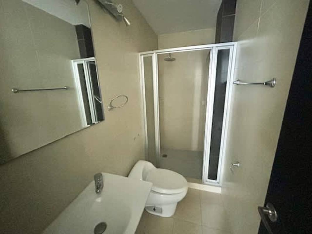 Spacious kitchen with granite tops and wood cabinets in PH The Bridge luxury apartment Panama