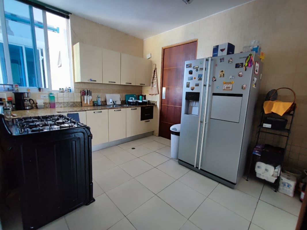 Primary bedroom with city view window, built-in closet in Barcelona Tower Panama