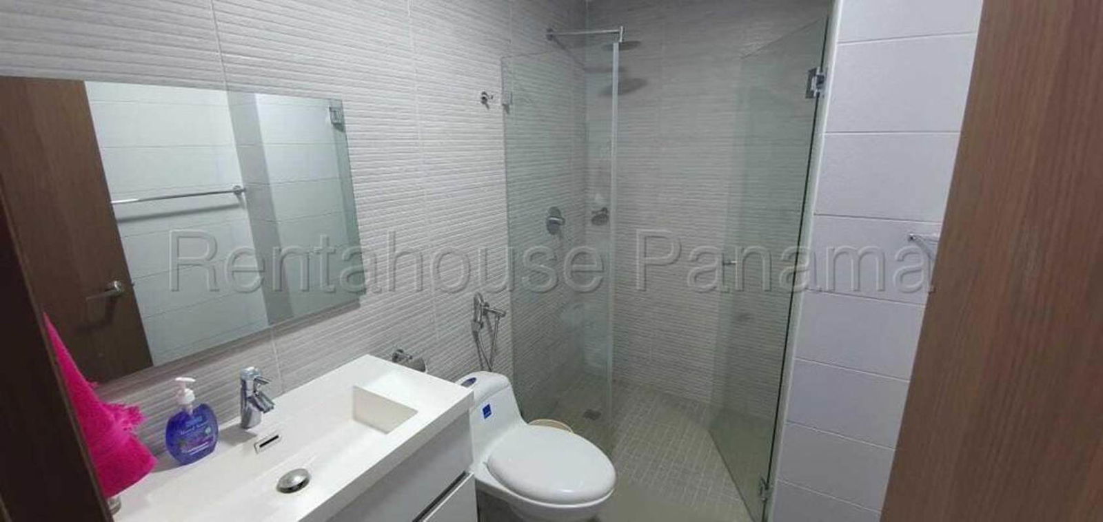 Modern bathroom with glass shower and white vanity in PH Altamira Panama City