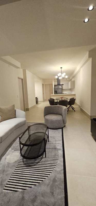 Bright bedroom with large windows overlooking golf course in Santa Maria Panama