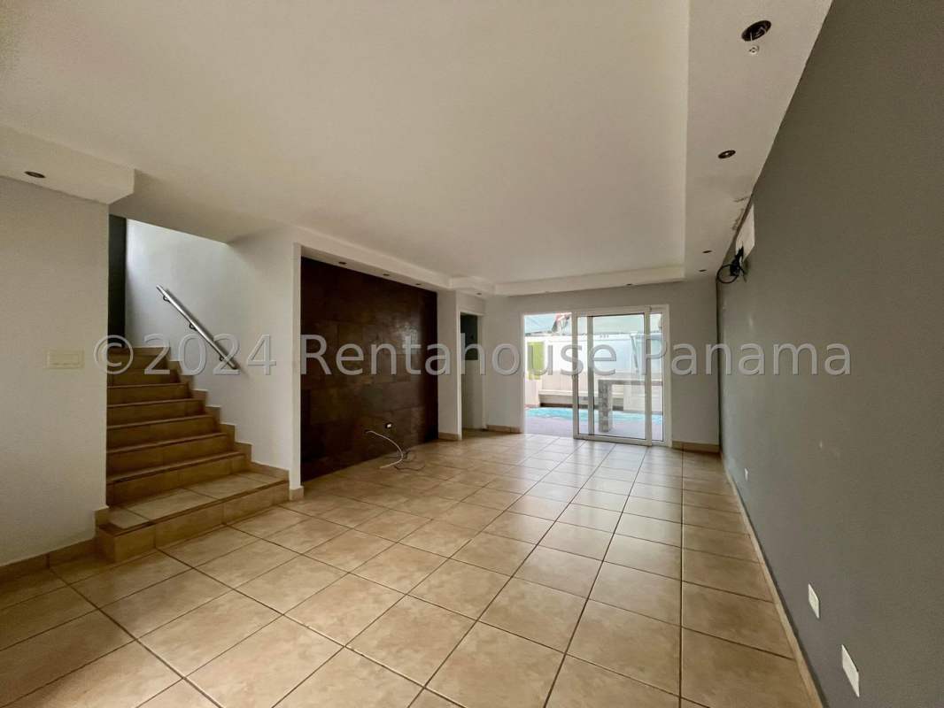 Interior modern staircase metal railing large windows PH Alpes Brisas del Golf