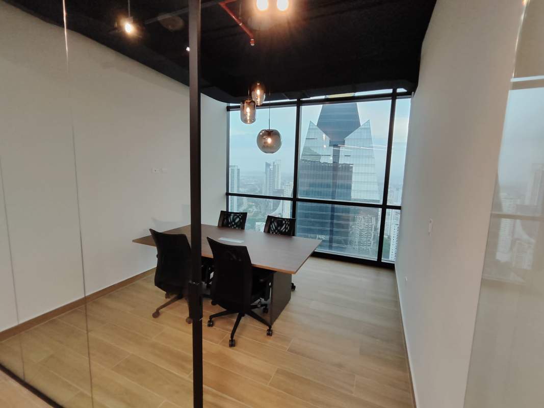 Open plan office space with partition desks and wood floors Costa del Este