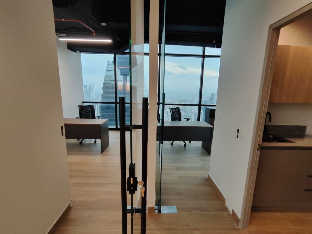 Reception space with desk, wood accents, modern lighting PH Financial Park Panama