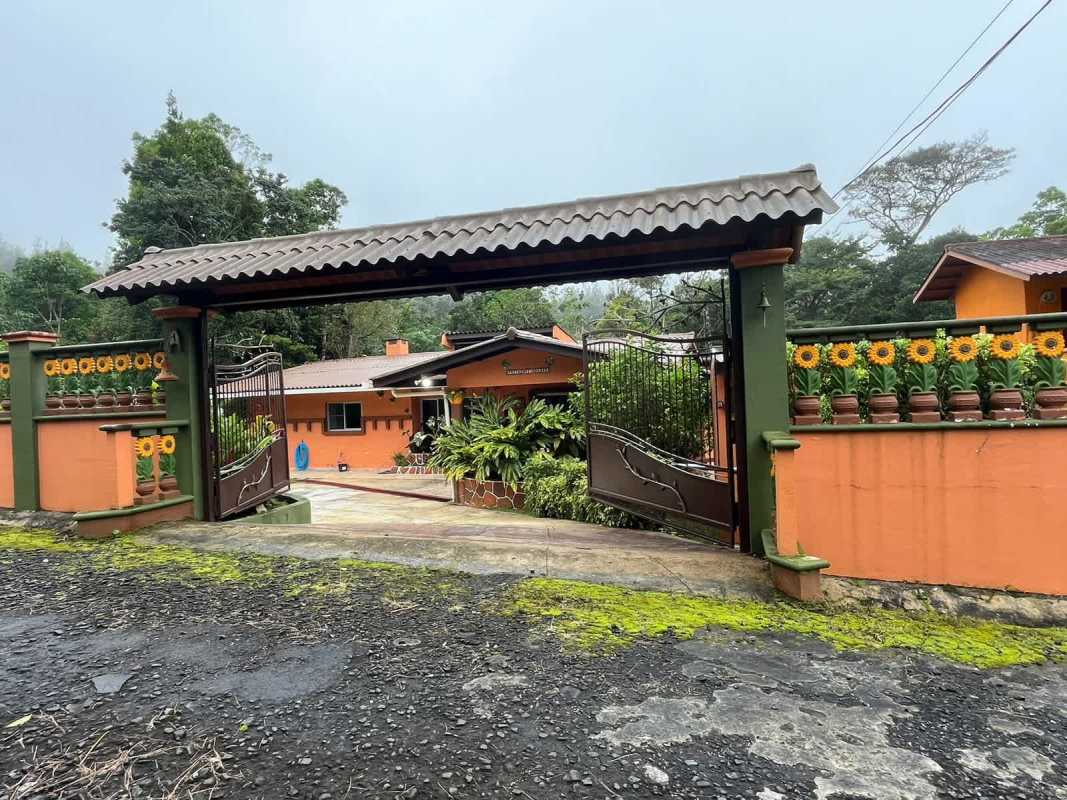Laundry room with washing machine hookups, utility sink, bright window in Cerro Azul Panama property