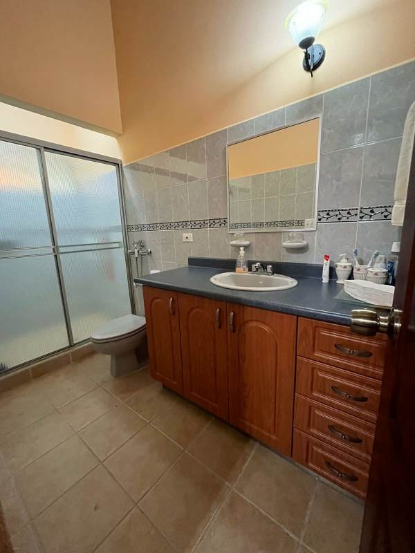 Rustic dining room with fireplace textured orange walls and chandelier mountain house Panama
