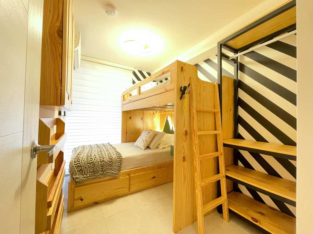 Compact bedroom with bunk bed and storage ideal for families or rentals PH Costana Panama City