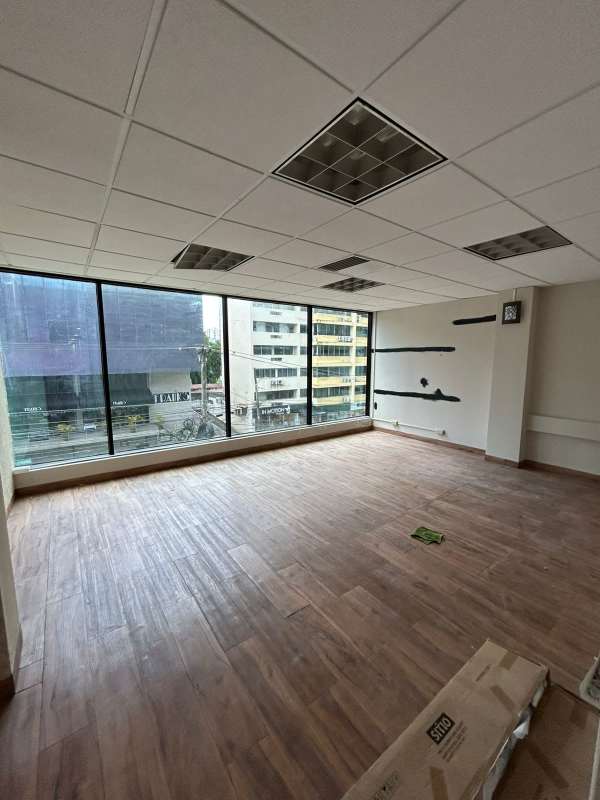 Modern glass facade of PH Obarrio Tower commercial building Panama City