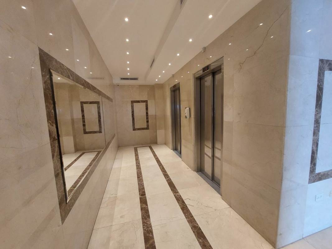 Open modern office space with floor-to-ceiling windows overlooking Panama City