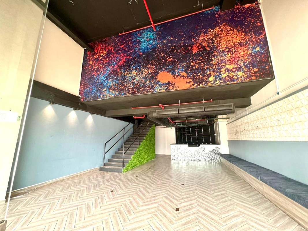 Lobby with staircase modern design mural ceiling vertical garden PH The Towers Calle 50 Panama