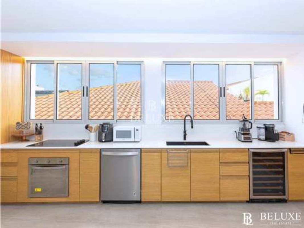 Spacious living room with colonial details and balcony access in PH Las Bóvedas Casco Viejo Panama