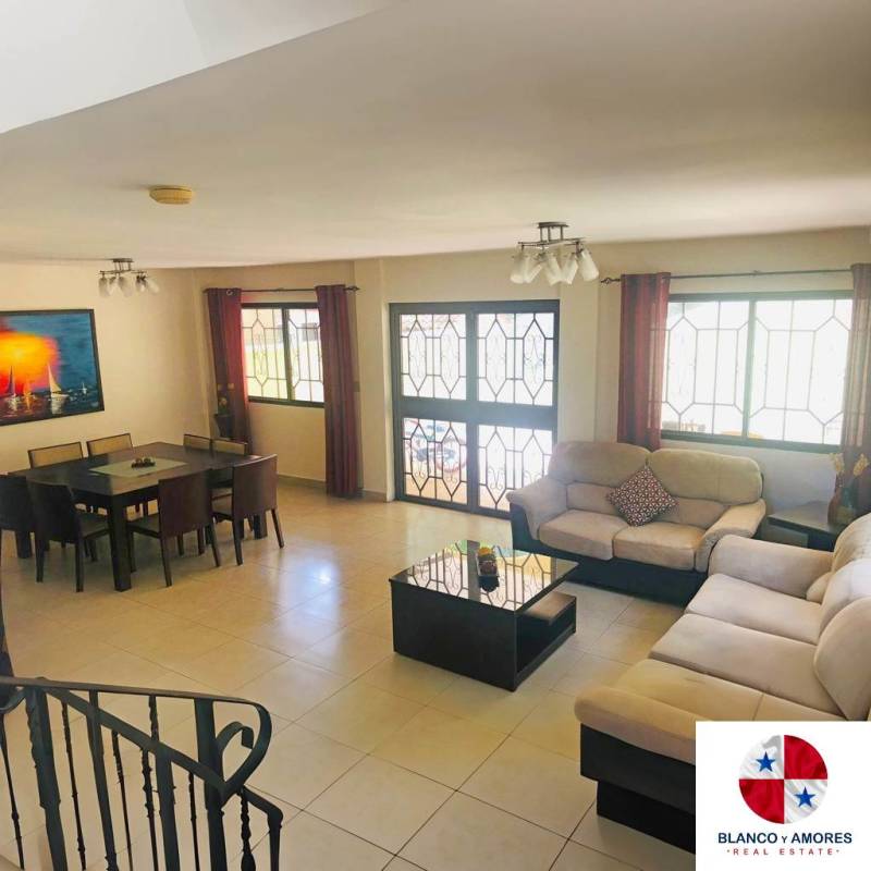 Spacious living room with tiled floors leading to covered terrace Ancon Panama
