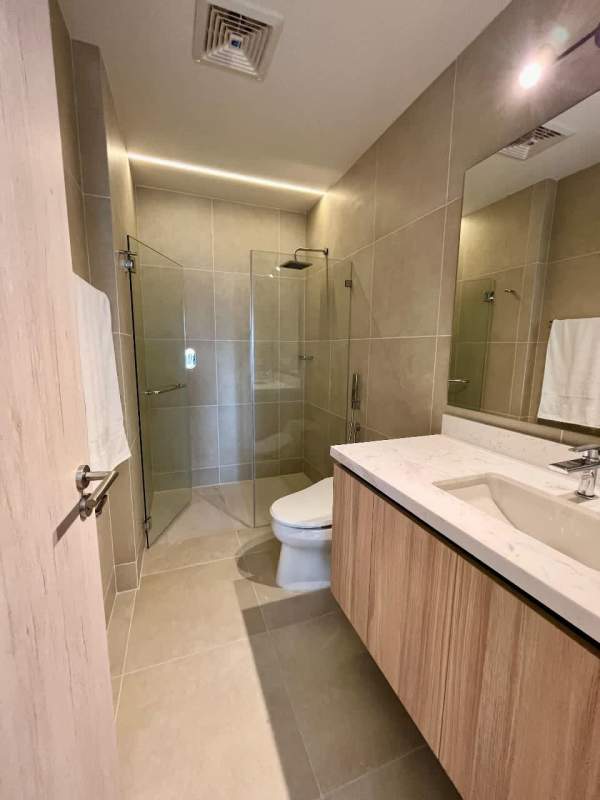 Luxury bedroom with expansive golf course views at Santa María Golf residences Panama