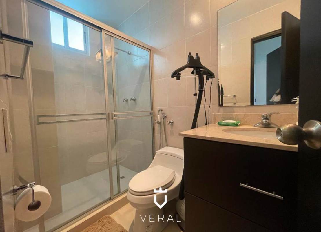 Outdoor lounge with wicker furniture overlooking city at PH Veranda Tower Coco del Mar Panama