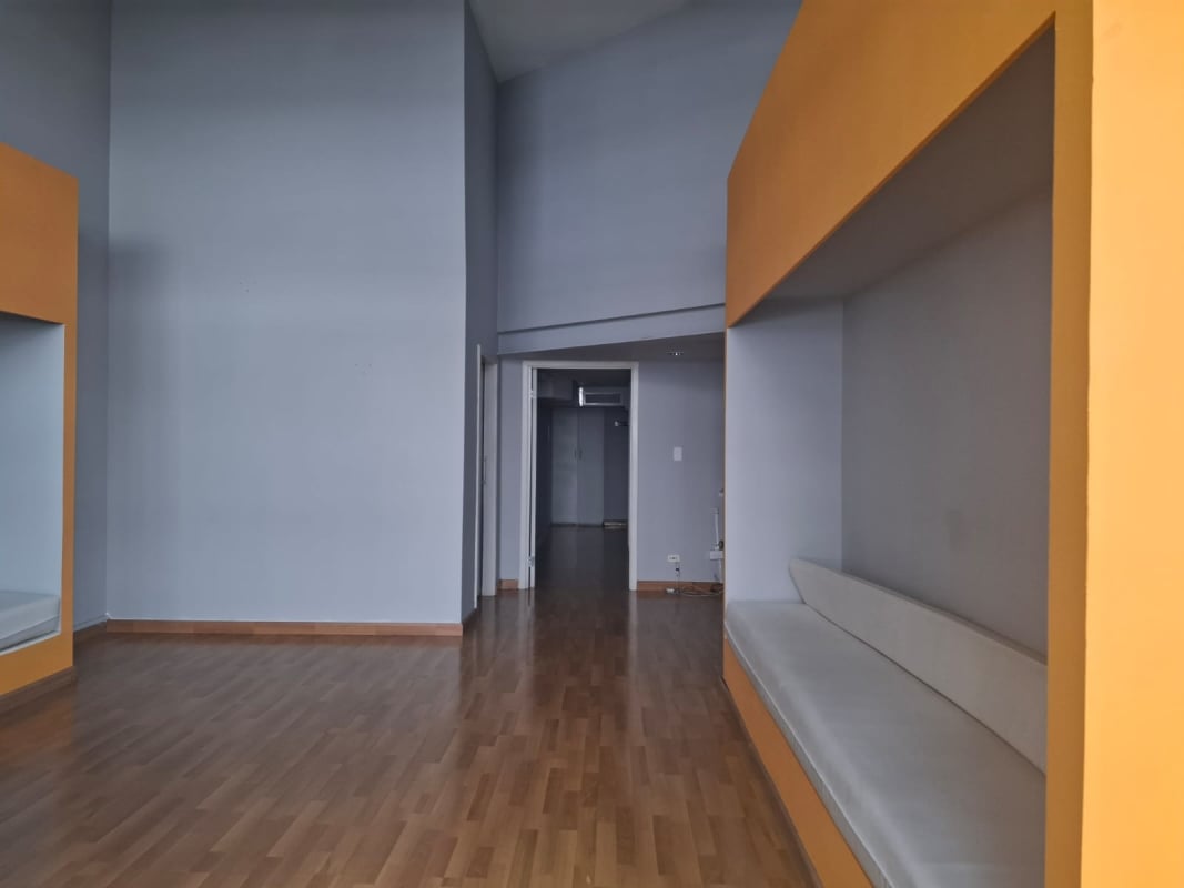 Lobby hallway common area with built-in orange cushioned benches commercial plaza San Francisco Panama