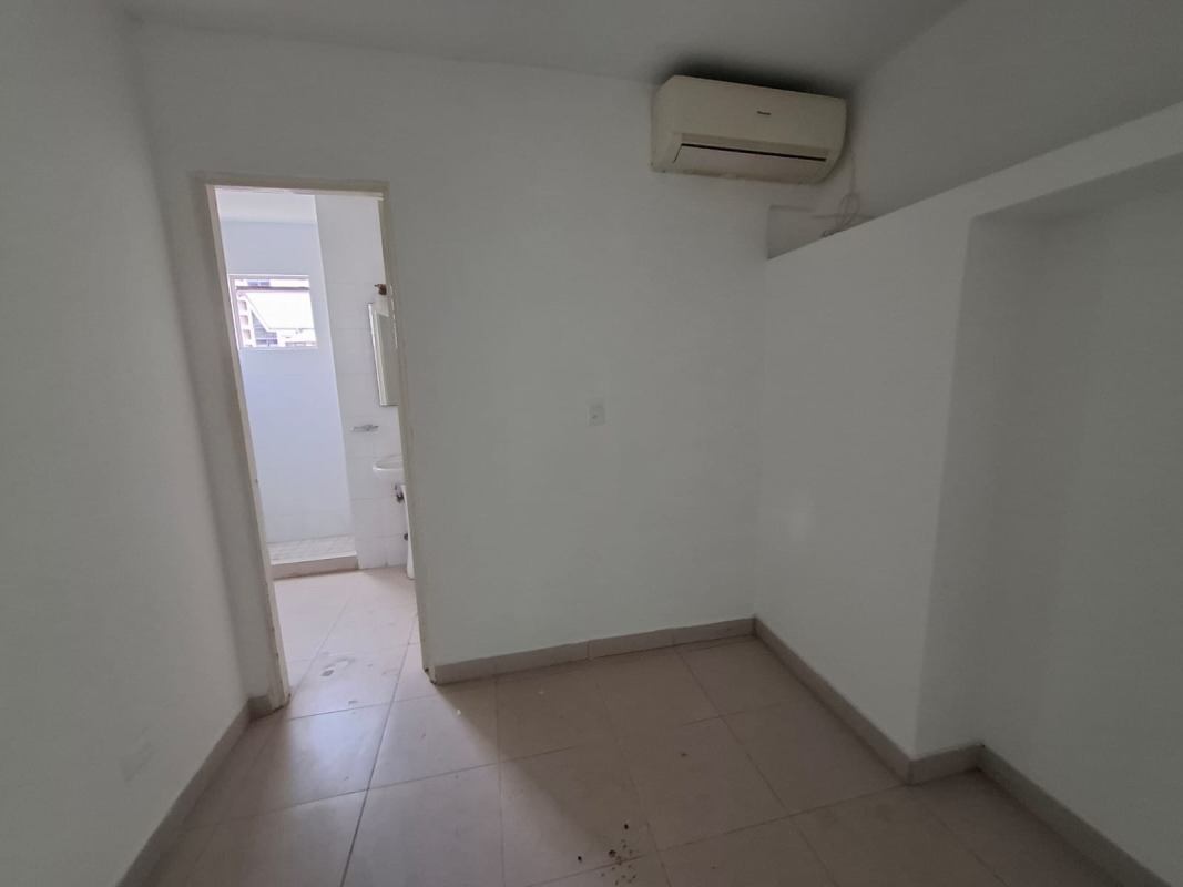Laundry space and service room with window and tiled walls in Tao Tower Panama