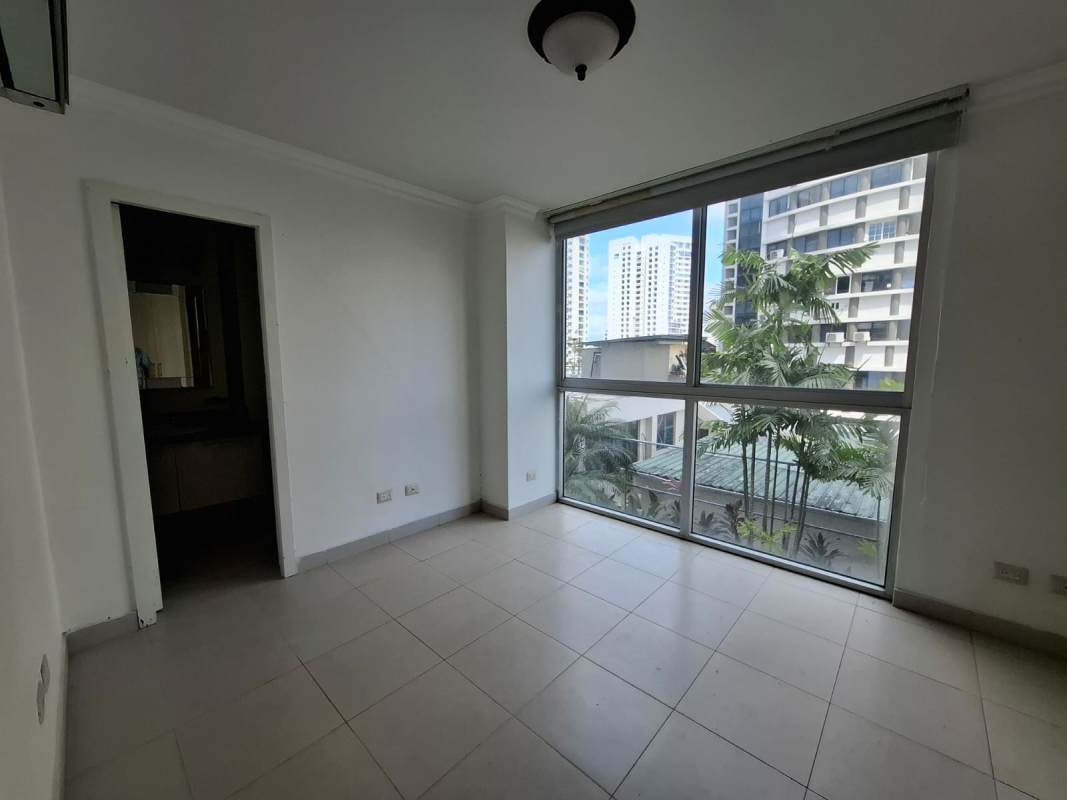 Bright living room with floor-to-ceiling windows, ceramic floors, balcony access Panama Tao Tower