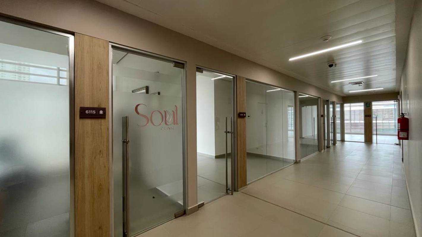 Minimalist small bathroom with sink and toilet in Costa del Este office space