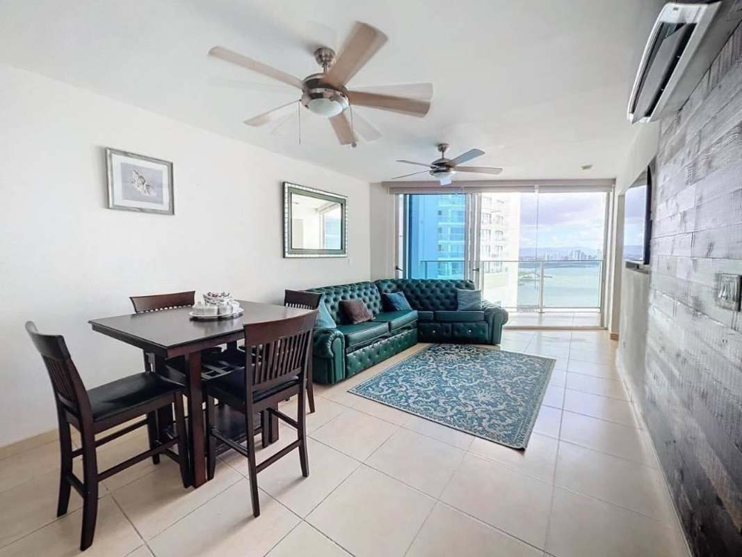 Bright living room with ocean views and access to private balcony at PH Oasis Punta Pacifica Panama