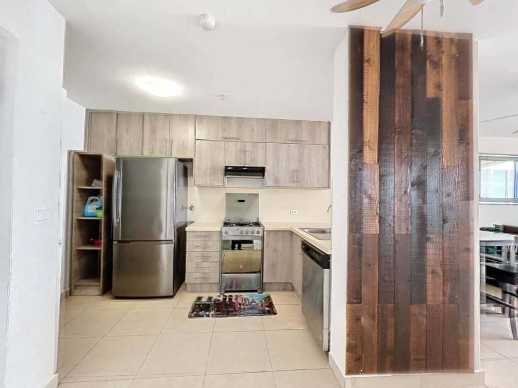 Modern furnished bedroom with large windows and water views in PH Oasis Punta Pacifica Panama