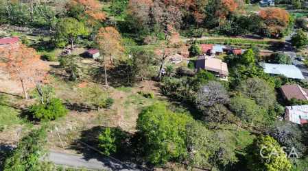 Aerial view of large fenced land parcel near downtown Boquete with mountain views