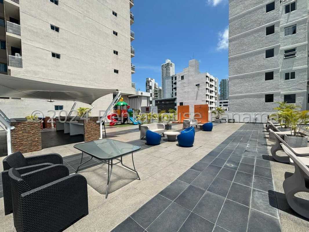 Rooftop lounge with city view and seating areas at PH Serenity at the Bay Panama City