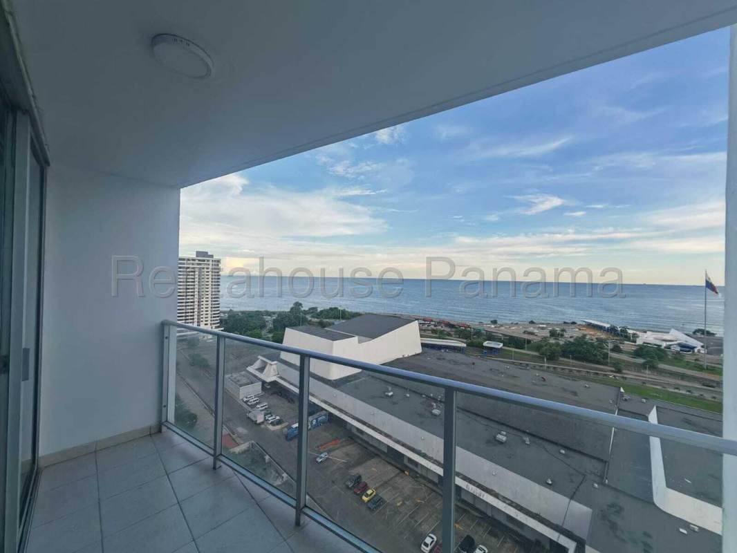 Modern glass balcony with city skyline and Pacific Ocean views at PH Serenity Panama