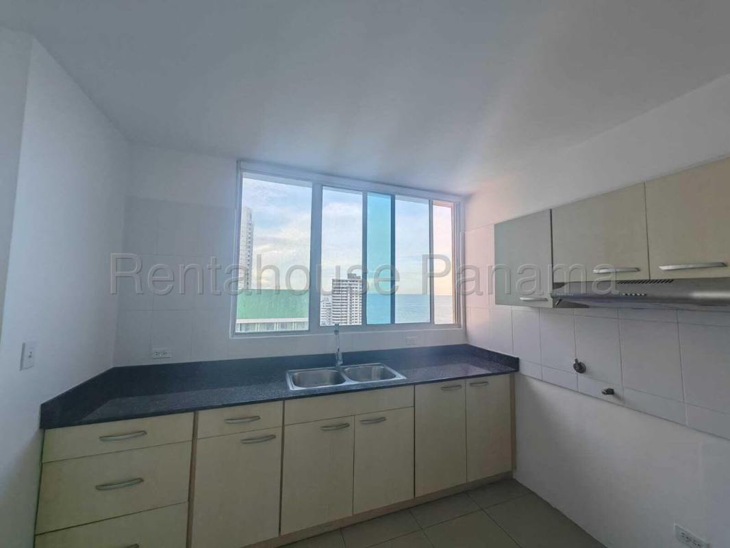 Modern closed kitchen with granite counters, window view at PH Serenity at the Bay Panama City
