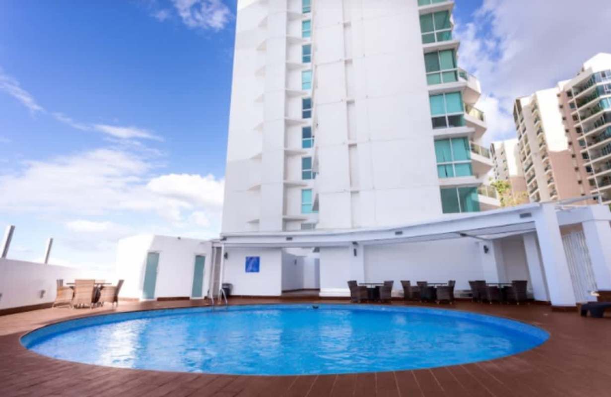 Rooftop pool with sunning deck, children's play area at PH El Mare 600 Panama City