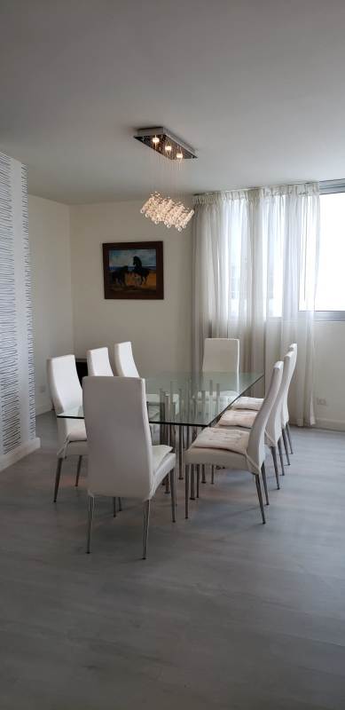 Large apartment living and dining room open to kitchen with city views in PH Joy Panama