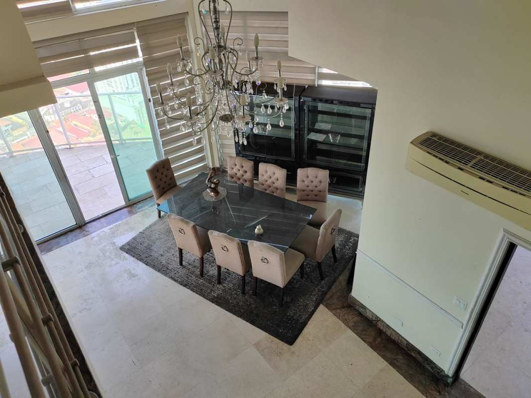 Elegant dining space in duplex penthouse with panoramic windows Highland View Panama