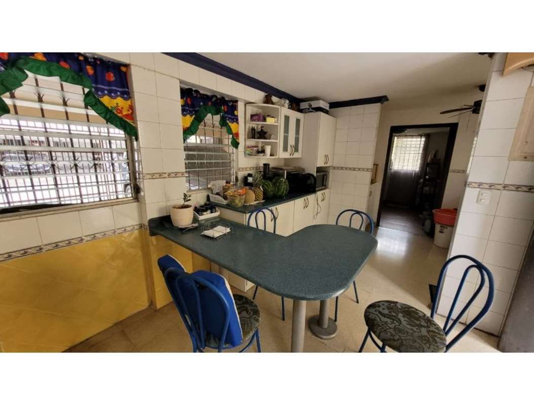 Large kitchen space with tile counters traditional cabinets in Altos del Golf Panama