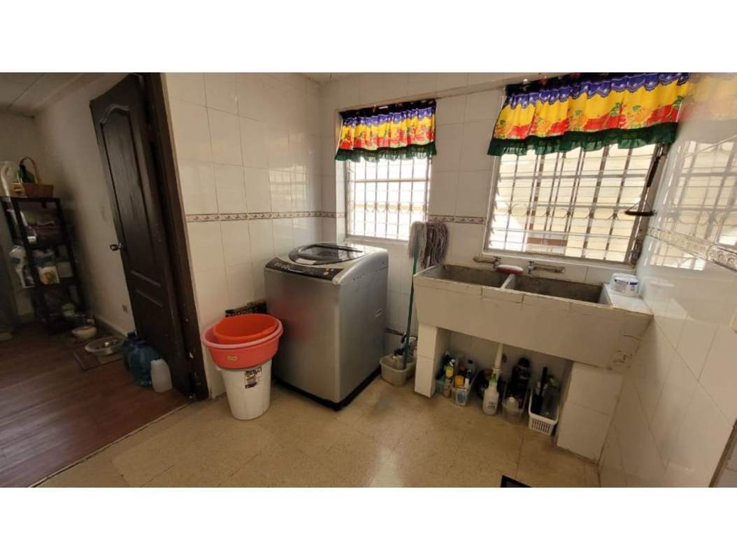 Spacious laundry room with washer utility sink and window Altos del Golf Panama