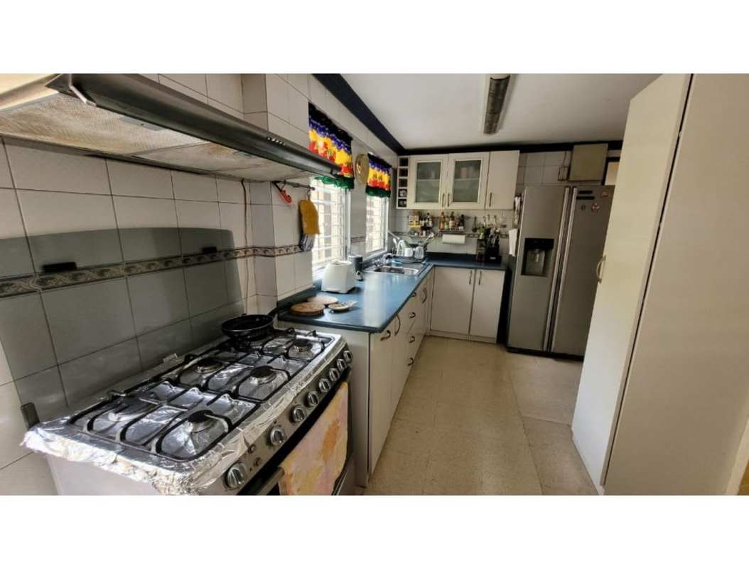 Modern kitchen with white cabinets and stainless appliances Altos del Golf Panama