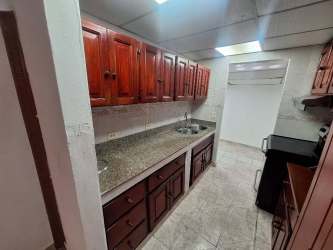 Bathroom with ceramic tiles walk-in shower pedestal sink Fundavico Panama