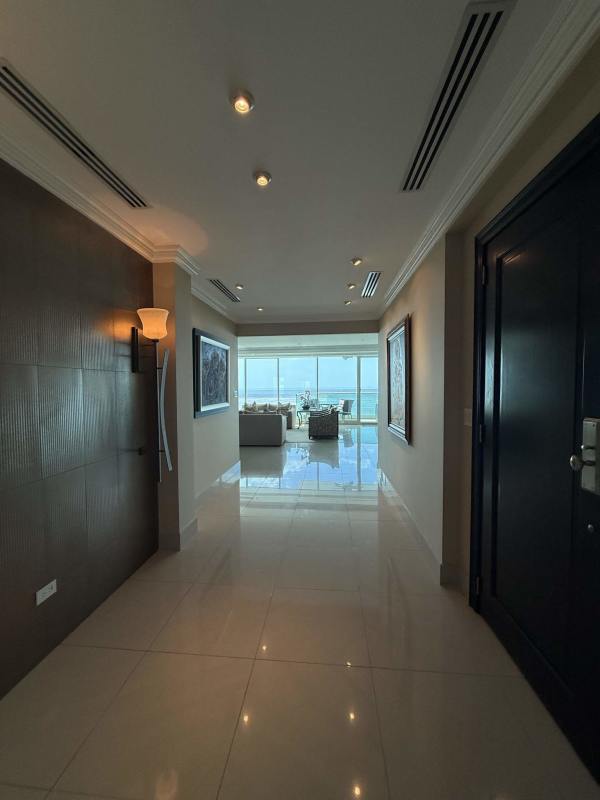 Gourmet kitchen with granite island and appliances overlooking ocean at PH Ocean One Panama