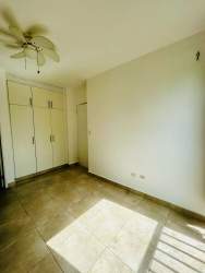 Bright bedroom with balcony access and ocean view at PH Altamarina Playa Dorada Panama