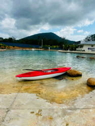 Living and dining space with balcony access overlooking Playa Dorada ocean views in Panama