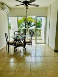 Modern bathroom with glass shower and granite vanity in Playa Dorada apartment Panama