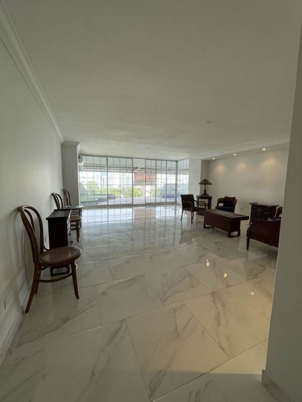 Spacious living room, marble tile flooring, large windows, neutral decor in PH Tamanaco Panama