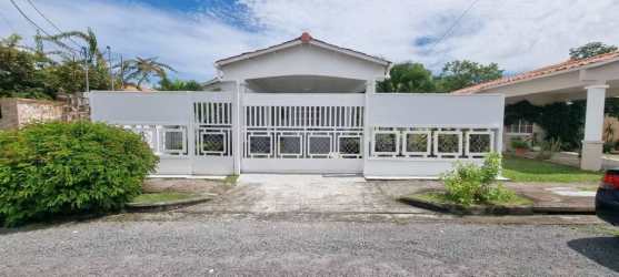 Gated front with paved driveway and carport Penonomé Panama