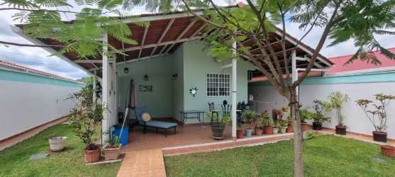 Green backyard with trees and covered back patio Penonomé Panama