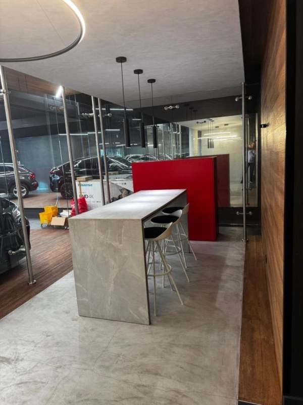 Contemporary office space with marble conference table and view of parking in Obarrio Panama