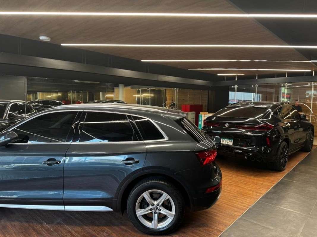 High-end luxury vehicle showroom with modern lighting in Business Tower Calle 50 Obarrio Panama