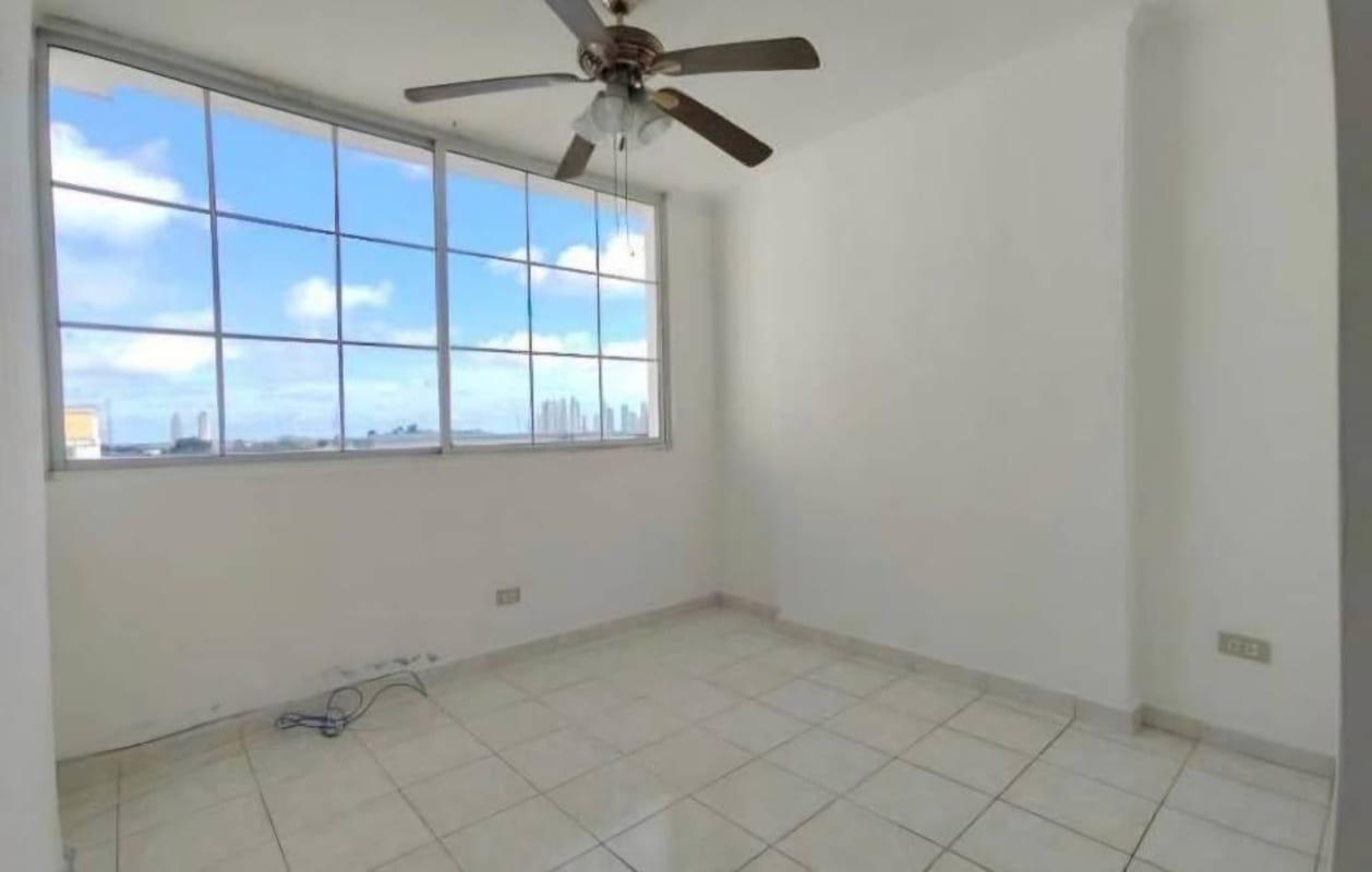 Bedroom with large window, city view, ceiling fan and tiled floor in PH Mystic Hills El Crisol Panama
